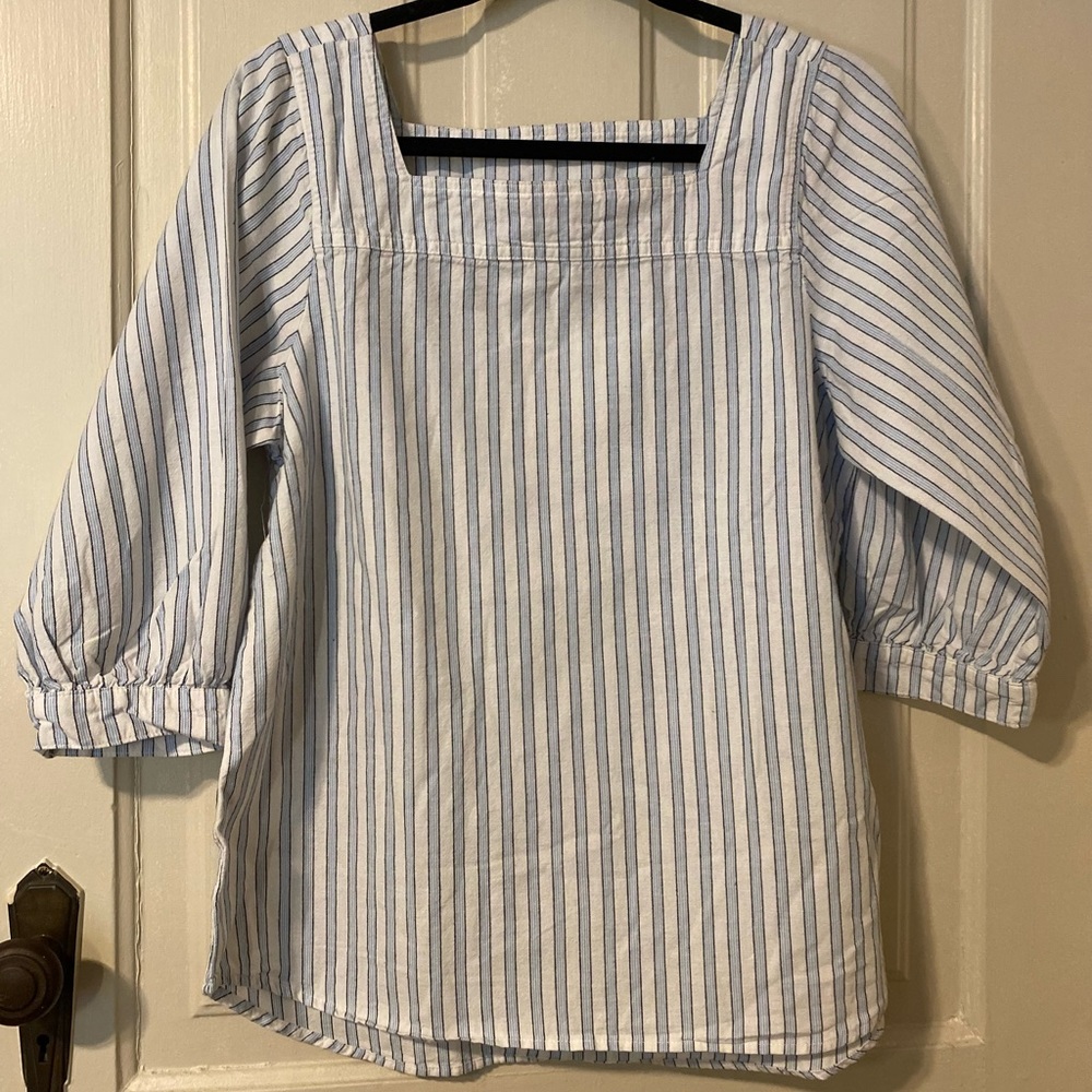 Blue and white shirt.